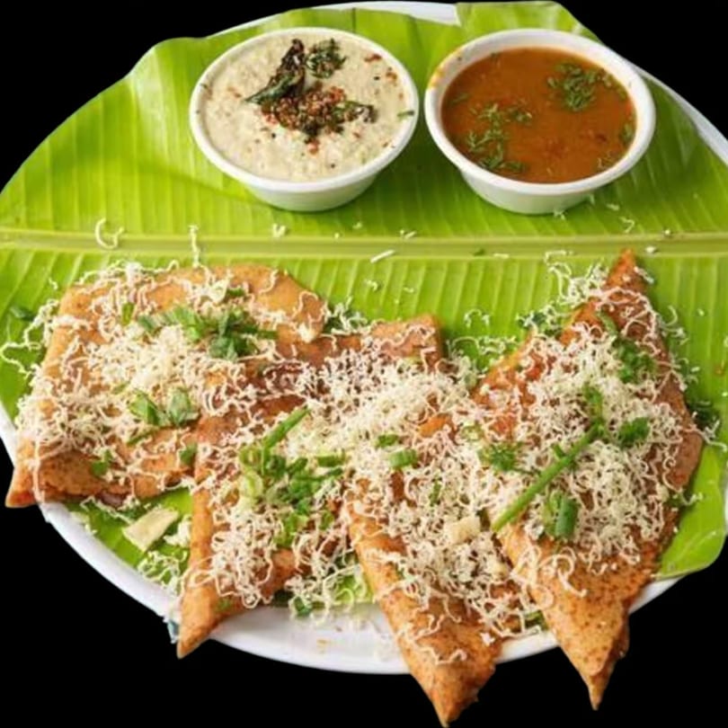 Three cheese dosas with chutney and sambar, served on a banana leaf at Bawarchi Biryanis.